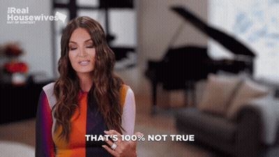 A Woman Says That 'S 100 % Not True While Standing In Front Of A Piano GIF
