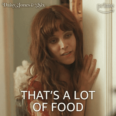 A Woman Says That 'S A Lot Of Food While Standing In Front Of A Door GIF