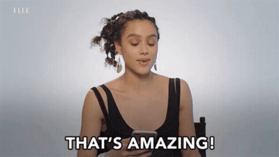 A Woman Says That 'S Amazing While Holding A Cell Phone GIF