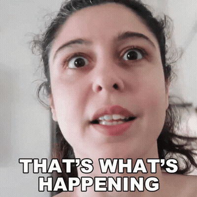 A Woman Says That 'S What 'S Happening In Front Of A White Background GIF