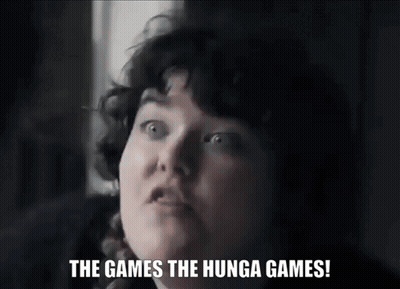A Woman Says " The Games The Hunga Games " In A Black And White Photo GIF