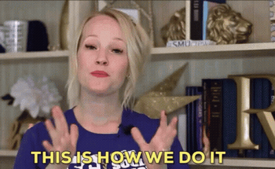 A Woman Says " This Is How We Do It " In Front Of A Bookshelf GIF