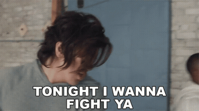 A Woman Says " Tonight I Wanna Fight Ya " In Front Of A Blue Door GIF