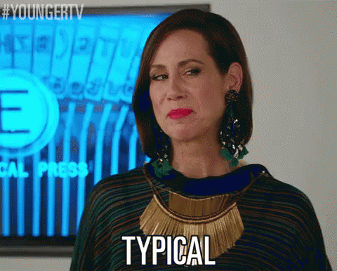 A Woman Says Typical In Front Of A Tv GIF