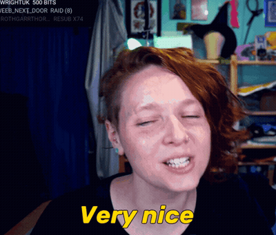 A Woman Says Very Nice In Yellow Letters GIF