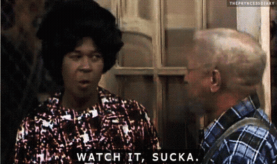 A Woman Says Watch It Sucka While Talking To A Man In A Plaid Shirt GIF