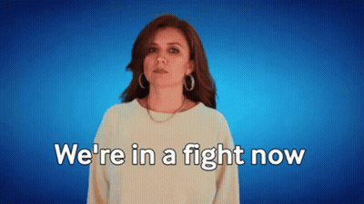 A Woman Says " We 'Re In A Fight Now " On A Blue Background GIF