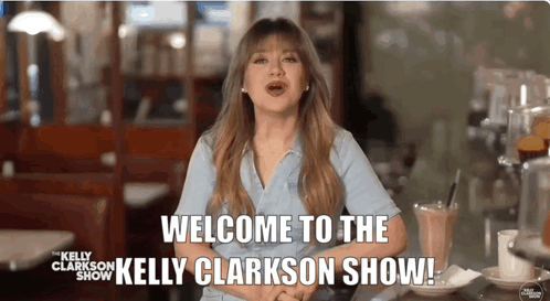 A Woman Says Welcome To The Kelly Clarkson Show While Sitting At A Table GIF