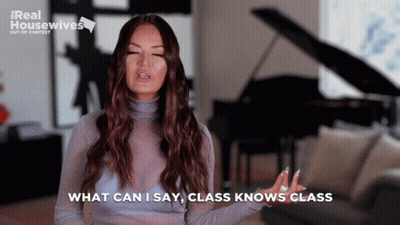 A Woman Says " What Can I Say Class Knows Class " While Standing In Front Of A Piano GIF