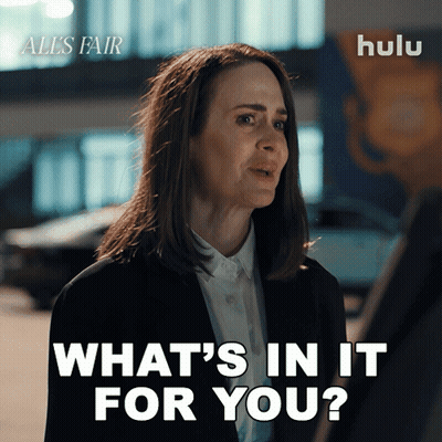 A Woman Says What 'S In It For You In Front Of A Hulu Logo GIF