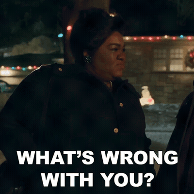 A Woman Says What 'S Wrong With You While Standing In Front Of A House GIF