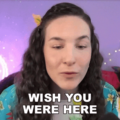A Woman Says Wish You Were Here In Front Of A Purple Background . GIF