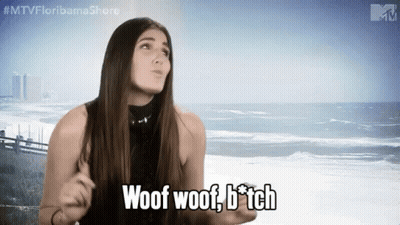 A Woman Says Woof Woof B * Tch In Front Of The Ocean GIF