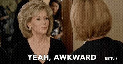 A Woman Says Yeah Awkward While Looking At Herself In A Mirror GIF