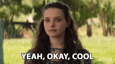 A Woman Says " Yeah Okay Cool " In Front Of A Green Field GIF