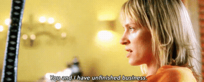 A Woman Says " You And I Have Unfinished Business " In A Movie Scene GIF