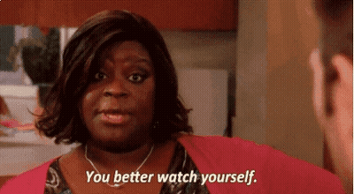 A Woman Says " You Better Watch Yourself " While Looking At A Man GIF