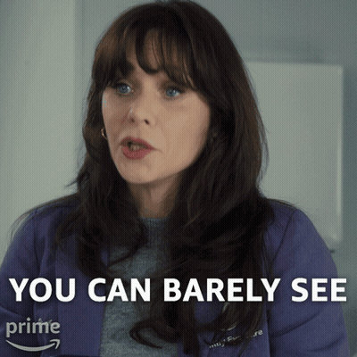 A Woman Says " You Can Barely See " While Wearing A Purple Shirt GIF
