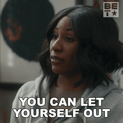 A Woman Says " You Can Let Yourself Out " While Wearing A Grey Sweatshirt GIF