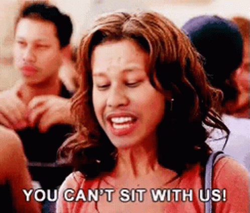 A Woman Says " You Can 'T Sit With Us " In Front Of A Crowd Of People GIF