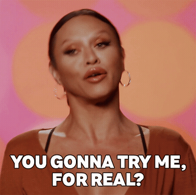 A Woman Says " You Gonna Try Me For Real " In Front Of A Colorful Background GIF