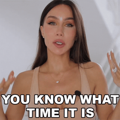 A Woman Says " You Know What Time It Is " In Front Of A White Background GIF