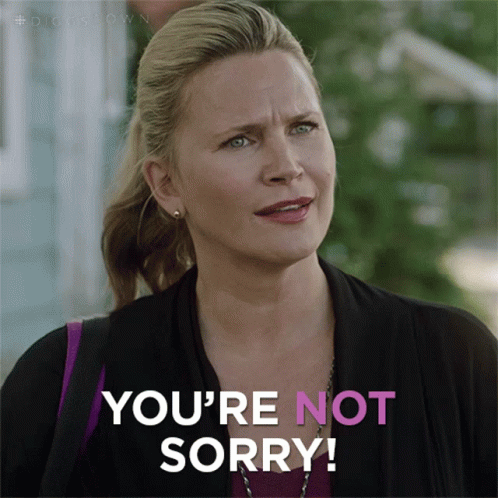 A Woman Says " You 'Re Not Sorry " In A Pink And White Graphic GIF