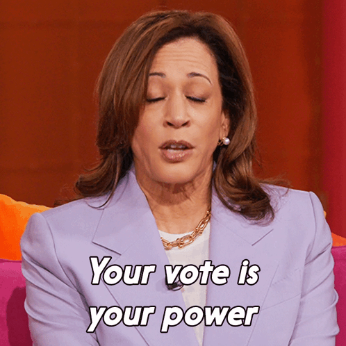 A Woman Says Your Vote Is Your Power In A Purple Jacket GIF