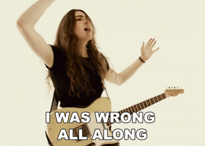 A Woman Singing And Playing A Guitar With The Words I Was Wrong All Along Below Her GIF