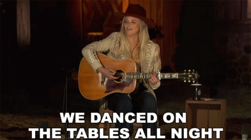 A Woman Singing And Playing A Guitar With The Words We Danced On The Tables All Night GIF