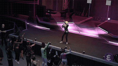 A Woman Singing In Front Of A Crowd Wearing A Number 33 Jersey GIF