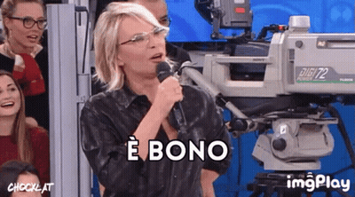 A Woman Singing Into A Microphone In Front Of A Camera That Says Digit72 GIF