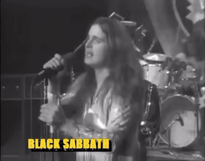 A Woman Singing Into A Microphone With Black Sabbath Written On The Bottom Right GIF