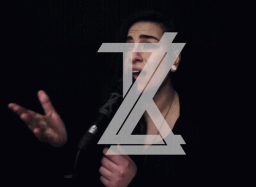 A Woman Singing Into A Microphone With The Letter Z Above Her Head GIF