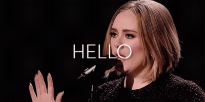 A Woman Singing Into A Microphone With The Word Hello Written Above Her GIF
