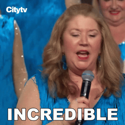 A Woman Singing Into A Microphone With The Word Incredible Written On The Bottom GIF