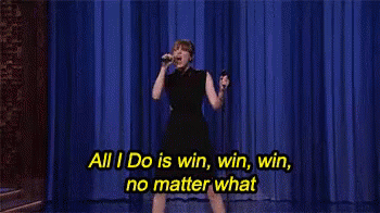 A Woman Singing Into A Microphone With The Words All I Do Is Win Win Win No Matter What Written Below Her GIF