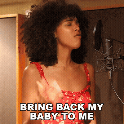 A Woman Singing Into A Microphone With The Words Bring Back My Baby To Me GIF