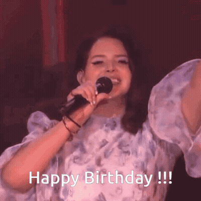 A Woman Singing Into A Microphone With The Words Happy Birthday GIF