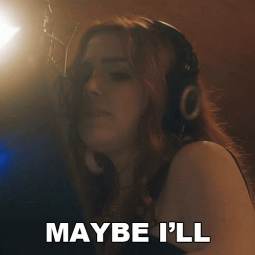 A Woman Singing Into A Microphone With The Words Have Some Fun Behind Her GIF