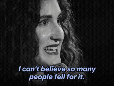 A Woman Singing Into A Microphone With The Words I Can 'T Believe So Many People Fell For It Below Her GIF