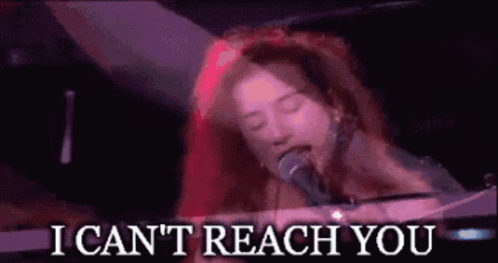 A Woman Singing Into A Microphone With The Words " I Can 'T Reach You " Above Her GIF