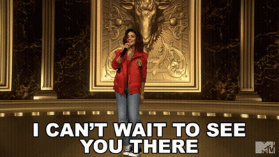 A Woman Singing Into A Microphone With The Words " I Can 'T Wait To See You There " Below Her GIF
