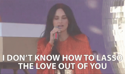 A Woman Singing Into A Microphone With The Words " I Don 'T Know How To Lasso The Love Out Of You " GIF