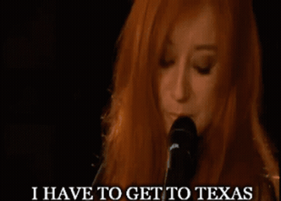 A Woman Singing Into A Microphone With The Words I Have To Get To Texas GIF