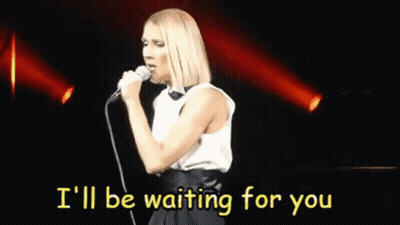 A Woman Singing Into A Microphone With The Words I 'Ll Be Waiting For You Behind Her GIF