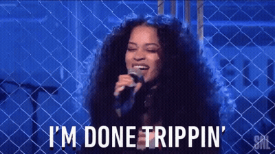 A Woman Singing Into A Microphone With The Words I 'M Done Trippin ' On The Bottom GIF