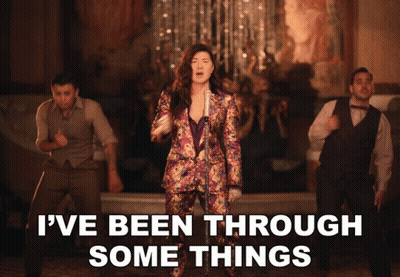 A Woman Singing Into A Microphone With The Words " I 'Ve Been Through Some Things " Below Her GIF