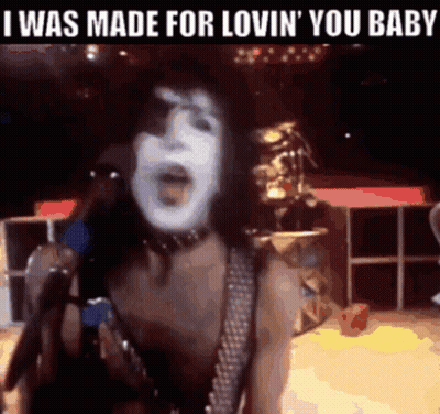 A Woman Singing Into A Microphone With The Words " I Was Made For Lovin ' You Baby " Above Her GIF