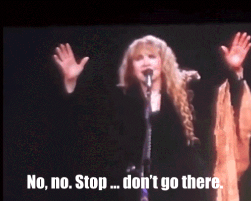 A Woman Singing Into A Microphone With The Words " No No Stop ... Don 'T Go There " Below Her GIF
